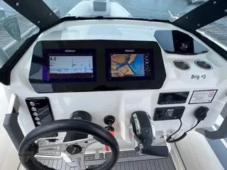 Slide: The Image of 2026 Brig Eagle 8 dashboard with dual navigation screens and steering wheel. - 22