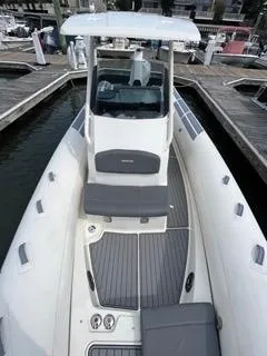 Slide: The Image of 2026 Brig Eagle 8 boat docked, featuring sleek design and spacious seating. - 26