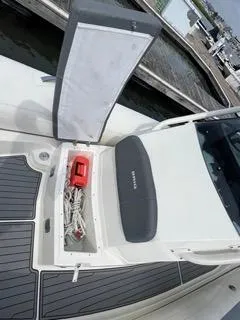 Slide: The Image of 2026 Brig Eagle 8 boat with open storage compartment and visible safety equipment. - 27