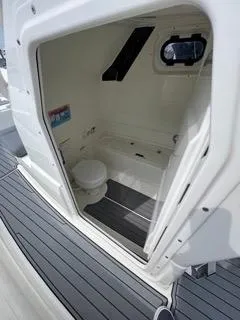 Slide: The Image of 2026 Brig Eagle 8 boat interior with compact bathroom and toilet. - 29