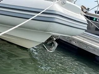 Slide: The Image of 2026 Brig Eagle 8 boat docked, featuring sleek design and sturdy anchor. - 34