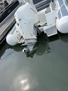 Slide: The Image of 2026 Brig Eagle 8 boat with outboard motor docked in marina. - 36