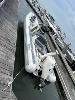 Slide: The Image of 2026 Brig Eagle 8 boat docked at a marina, featuring sleek design and modern amenities. - 38