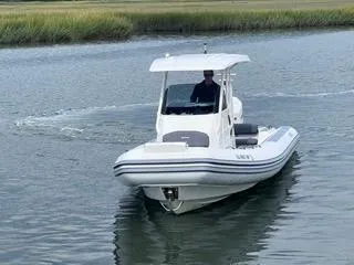 Slide: The Image of 2026 Brig Eagle 8 boat cruising on calm water. - 5