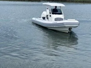 Slide: The Image of 2026 Brig Eagle 8 boat cruising on calm water. - 6