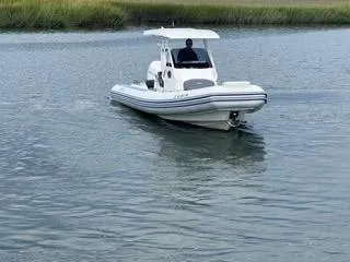 Slide: The Image of 2026 Brig Eagle 8 boat cruising on calm water. - 7