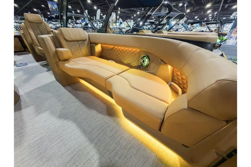 Slide: The Image of Luxurious interior of 2026 Godfrey SanPan 25' Split Bench Co-Captain boat with ambient lighting. - 10