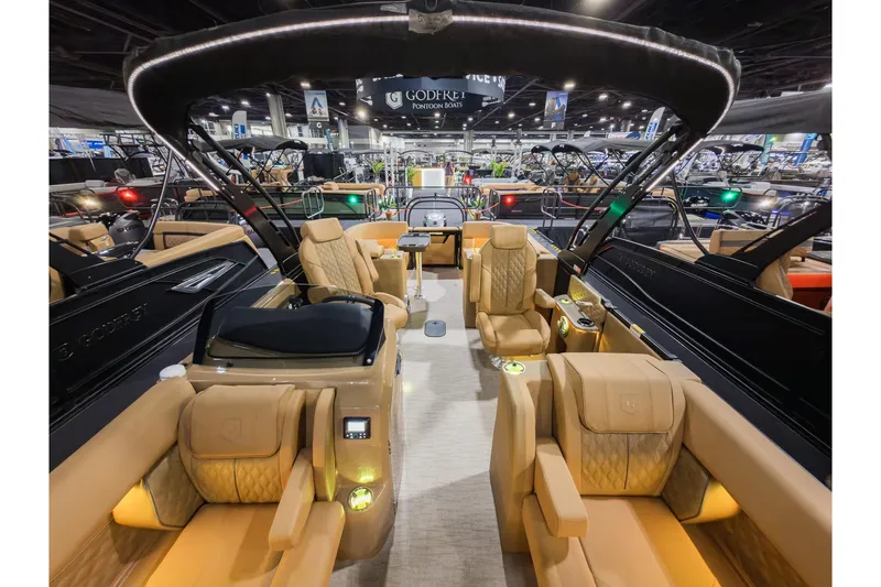 Slide: The Image of Luxurious 2026 Godfrey SanPan 25' pontoon boat interior with plush seating and modern design. - 17