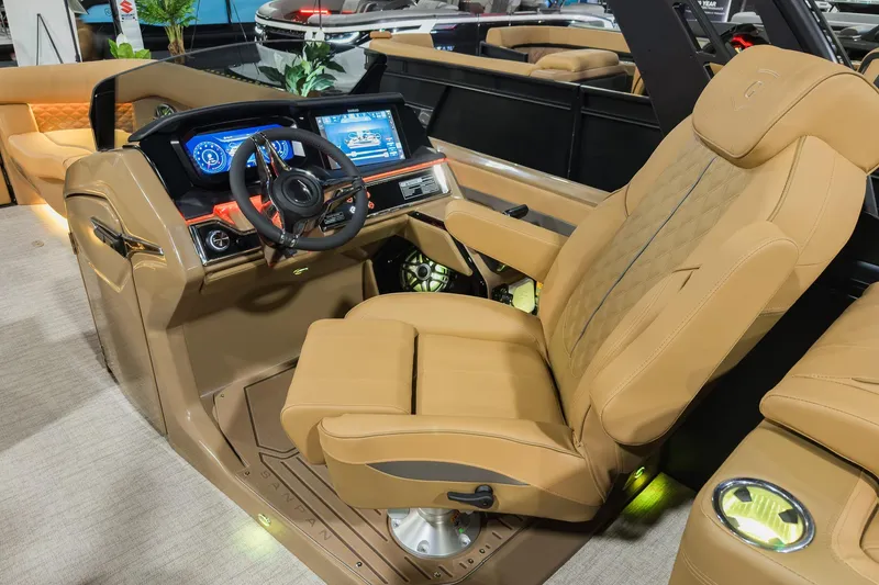 Slide: The Image of Luxurious helm of 2026 Godfrey SanPan 2500 SBC with advanced controls and plush seating. - 20