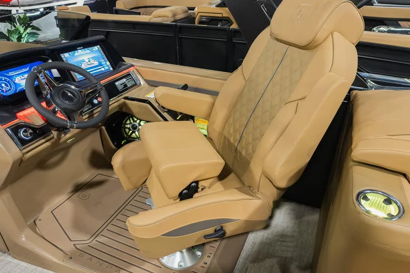 Slide: The Image of Luxurious interior of 2026 Godfrey SanPan 2500 SBC pontoon boat with captain's chair and dashboard. - 21