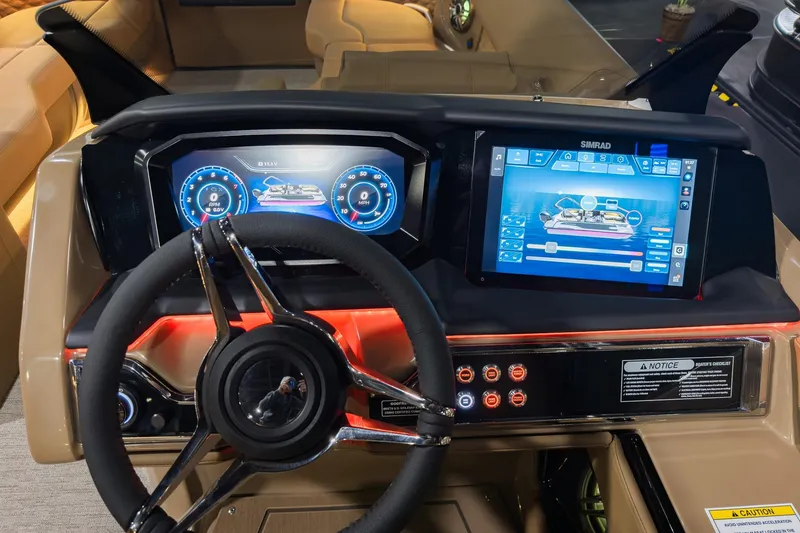 Slide: The Image of 2026 Godfrey SanPan 2500 SBC dashboard with advanced digital controls and steering wheel. - 22