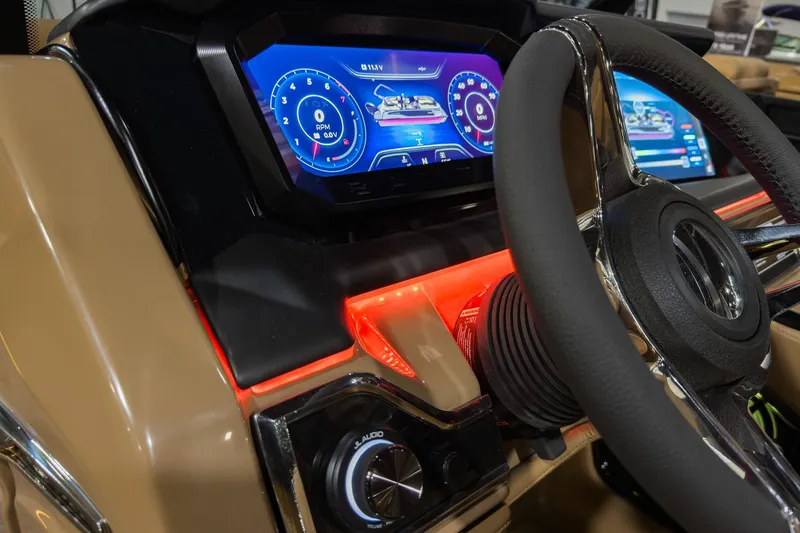 Slide: The Image of 2026 Godfrey SanPan 2500 SBC dashboard with illuminated controls and digital display. - 23