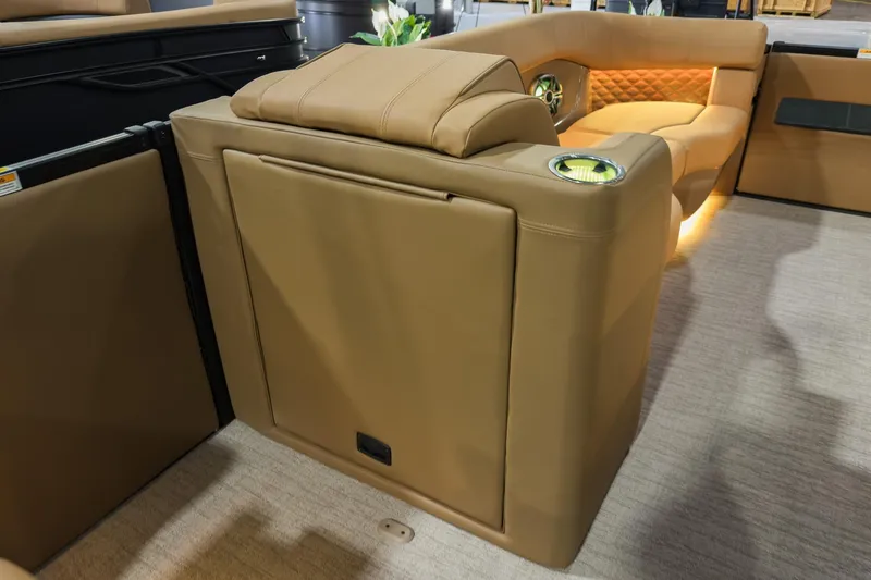 Slide: The Image of 2026 Godfrey SanPan 25' Split Bench Co-Captain interior with tan leather seating and cup holders. - 33