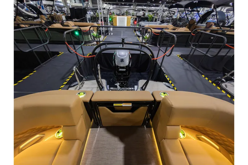 Slide: The Image of 2026 Godfrey SanPan 25' Split Bench Co-Captain boat interior with illuminated seating and motor. - 38