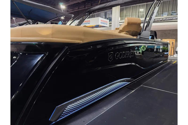 Slide: The Image of 2026 Godfrey SanPan 25' Split Bench Co-Captain pontoon boat with sleek black exterior. - 4