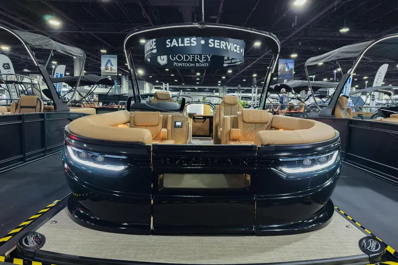 Slide: The Image of 2026 Godfrey SanPan 25' Split Bench Co-Captain pontoon boat at a showroom display. - 43