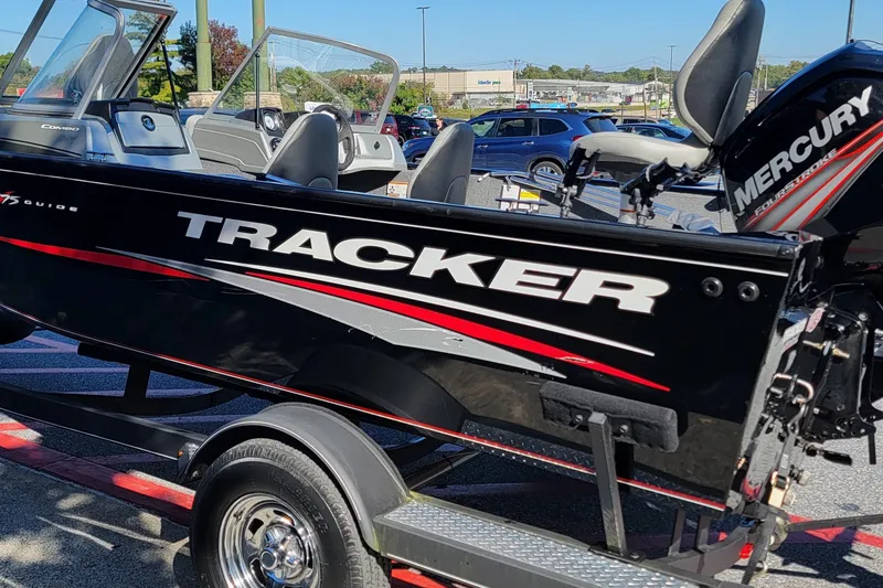 Slide: The Image of 2019 Tracker Pro Guide V-175 Combo boat on trailer, featuring Mercury engine. - 2