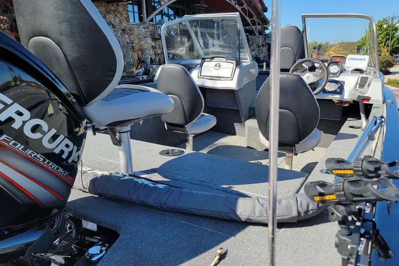 Slide: The Image of 2019 Tracker Pro Guide V-175 Combo boat interior with Mercury engine and fishing equipment. - 4