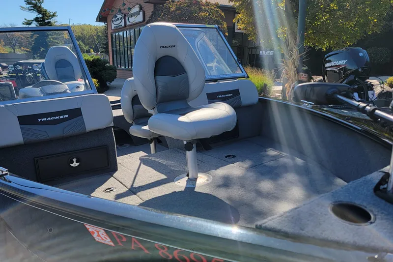 Slide: The Image of 2019 Tracker Pro Guide V-175 Combo boat interior with seating and Mercury engine. - 6