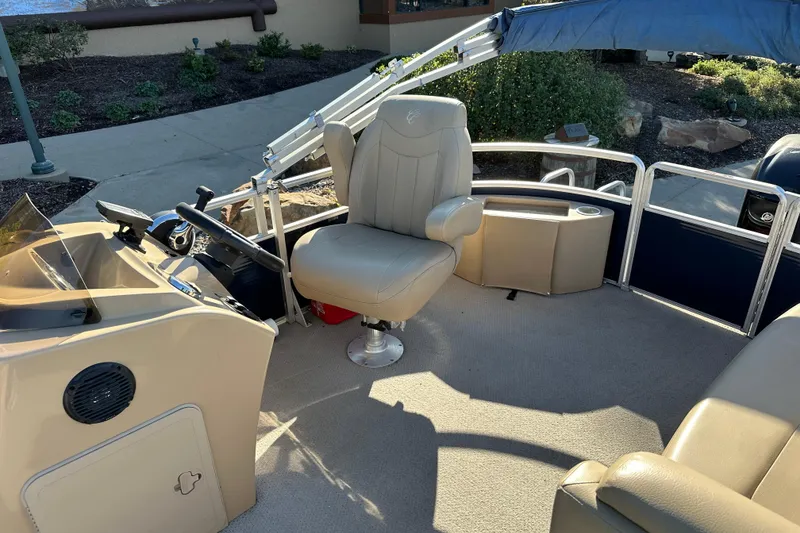 Slide: The Image of 2015 Harris FloteBote Cypress Cay Cambio 180 interior with helm and seating area. - 10