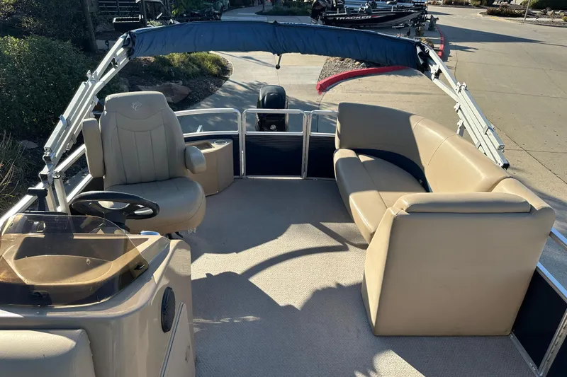 Slide: The Image of 2015 Harris FloteBote Cypress Cay Cambio 180 pontoon boat interior with beige seating. - 9