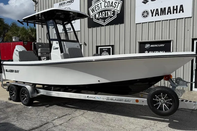 The Image of 2026 Blazer Bay 2440 boat on trailer at West Coast Marine dealership. - 1