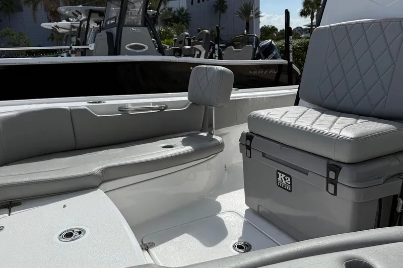 Slide: The Image of 2026 Blazer Bay 2440 boat interior with cushioned seating and storage. - 15