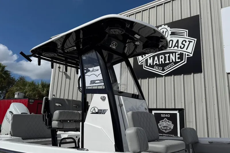 Slide: The Image of 2026 Blazer Bay 2440 boat at West Coast Marine dealership. - 4
