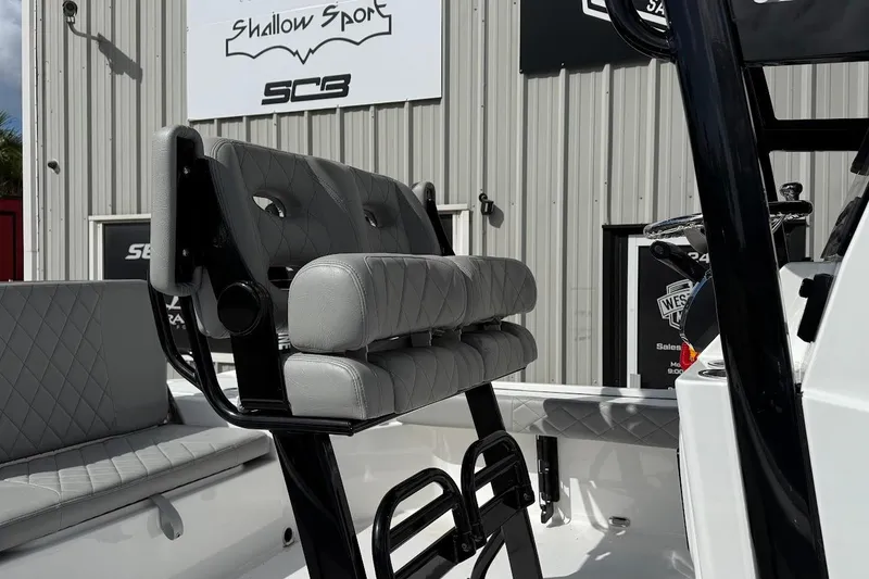 Slide: The Image of 2026 Blazer Bay 2440 boat interior with gray seating and black frame. - 5