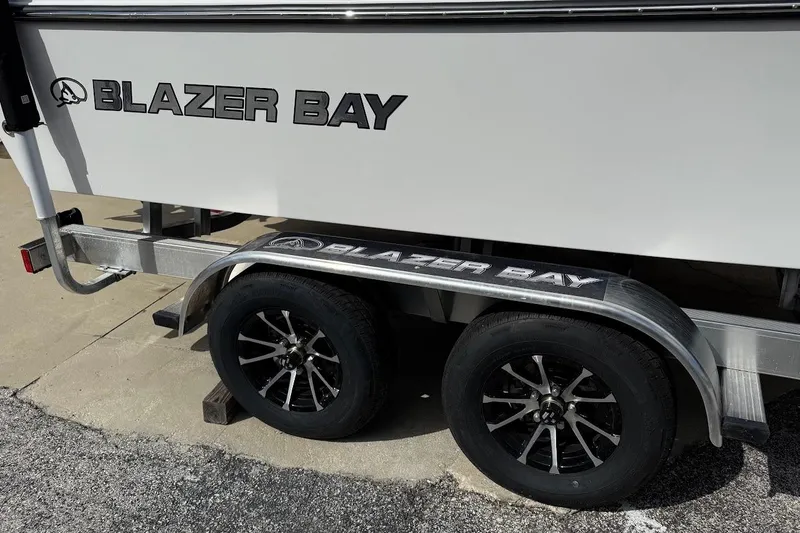 Slide: The Image of 2026 Blazer Bay 2440 boat on trailer with dual wheels. - 7
