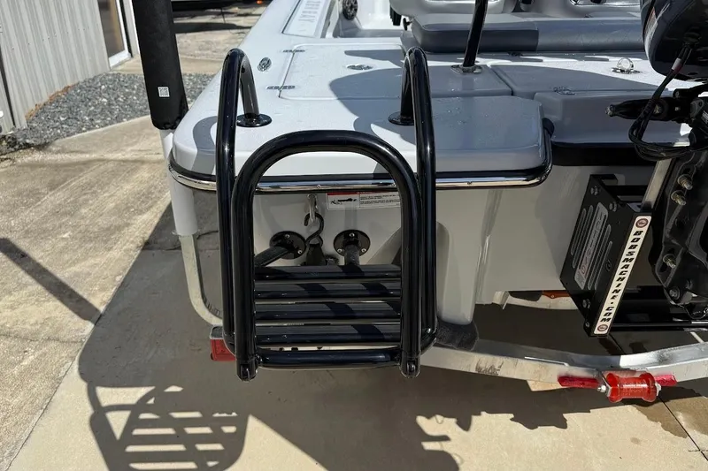 Slide: The Image of Rear view of 2026 Blazer 675 Ultimate Bay boat with ladder and motor mount. - 13