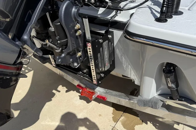 Slide: The Image of Close-up of 2026 Blazer 675 Ultimate Bay boat engine and hydraulic components. - 14