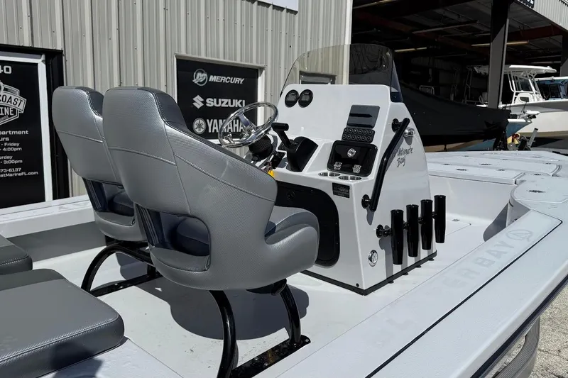 Slide: The Image of 2026 Blazer 675 Ultimate Bay boat interior with dual seats and control panel. - 17