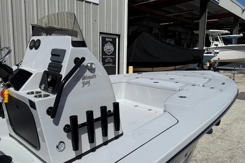 Slide: The Image of 2026 Blazer 675 Ultimate Bay boat at marina, featuring sleek design and modern controls. - 18