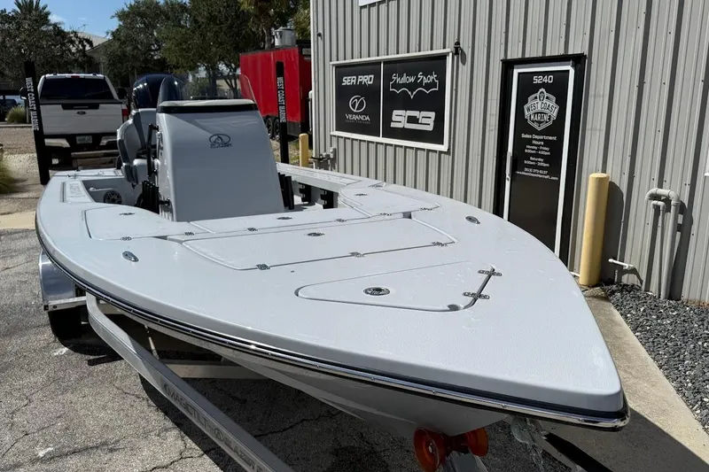 Slide: The Image of 2026 Blazer 675 Ultimate Bay boat parked outside a marine sales building. - 4