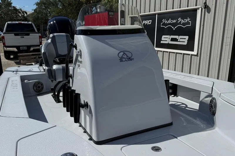 Slide: The Image of 2026 Blazer 675 Ultimate Bay boat console with seating and rod holders. - 6