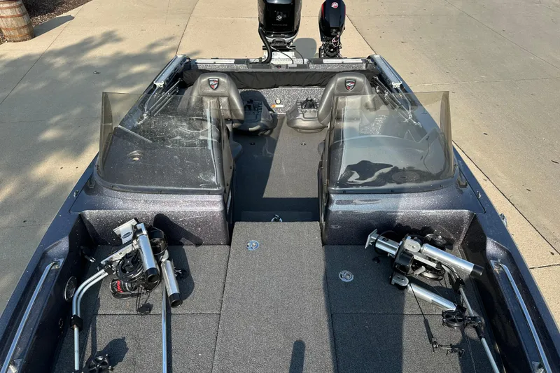 Slide: The Image of 2018 Triton 216 Fishunter boat interior with fishing equipment and dual consoles. - 10