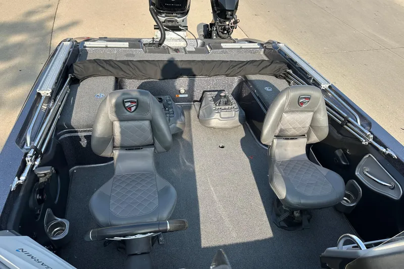 Slide: The Image of 2018 Triton 216 Fishunter boat interior with two seats and control panel. - 11
