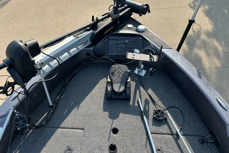 Slide: The Image of 2018 Triton 216 Fishunter boat deck with fishing equipment and controls. - 6