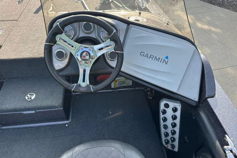 Slide: The Image of Steering wheel and dashboard of 2018 Triton 216 Fishunter with Garmin display. - 7