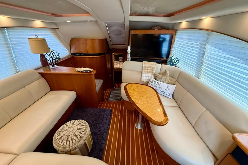 Slide: The Image of Luxurious interior of 2006 Tiara Yachts 3900 Convertible with elegant seating and decor. - 11
