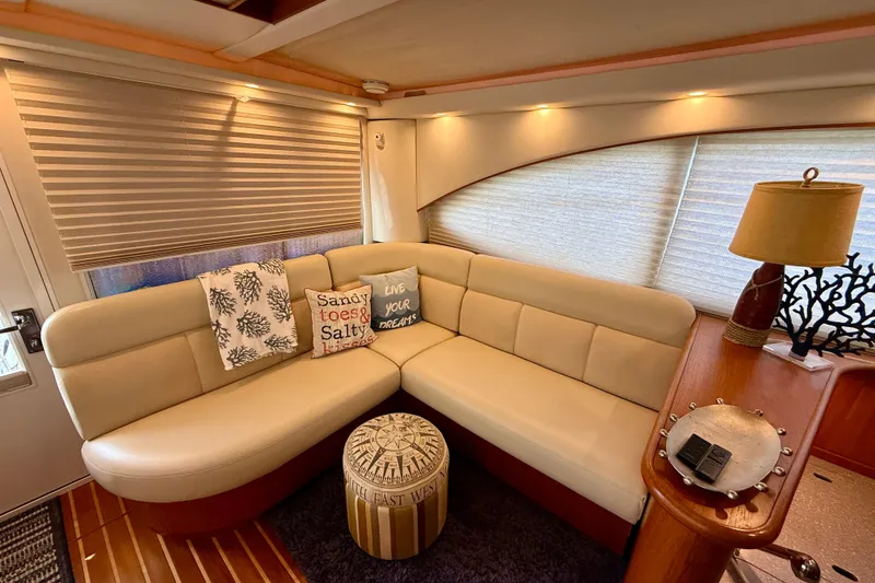 Slide: The Image of Luxurious interior of 2006 Tiara Yachts 3900 Convertible with cozy seating and nautical decor. - 15