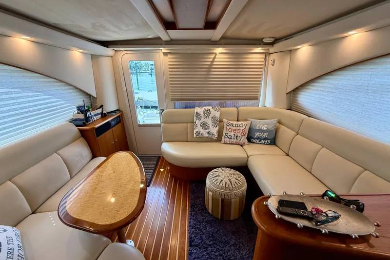 Slide: The Image of Luxurious interior of 2006 Tiara Yachts 3900 Convertible with plush seating and decorative pillows. - 16