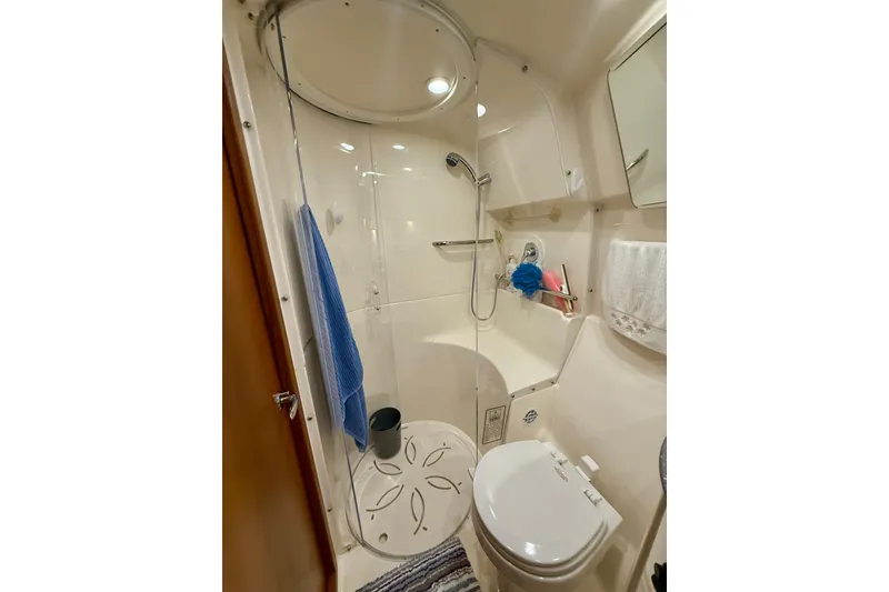 Slide: The Image of 2006 Tiara Yachts 3900 Convertible bathroom with shower, toilet, and storage. - 29