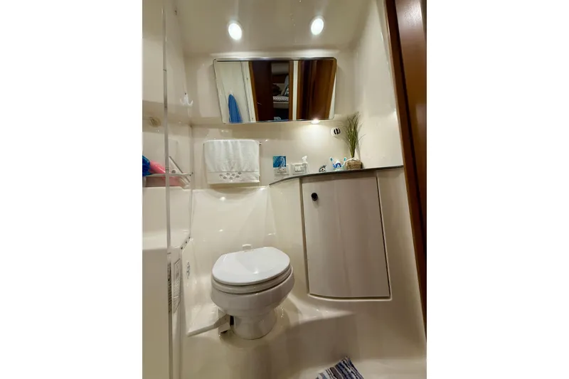 Slide: The Image of Bathroom interior of 2006 Tiara Yachts 3900 Convertible, featuring modern amenities and sleek design. - 30