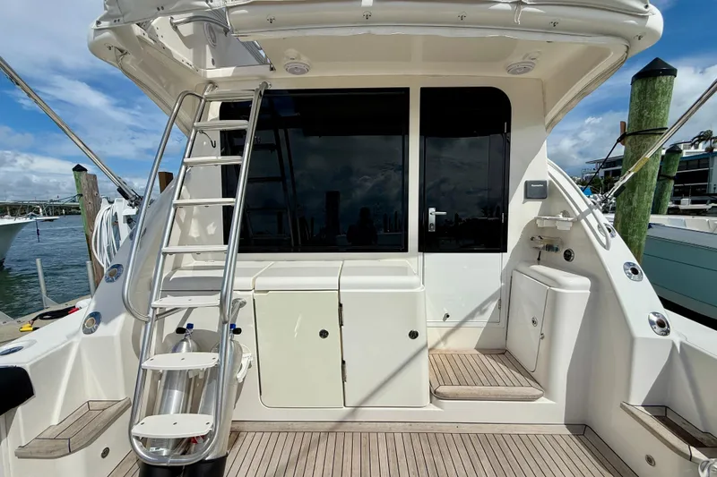 Slide: The Image of 2006 Tiara Yachts 3900 Convertible boat deck with ladder and storage compartments. - 31