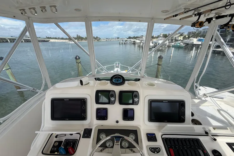 Slide: The Image of 2006 Tiara Yachts 3900 Convertible helm with navigation equipment, overlooking marina. - 33