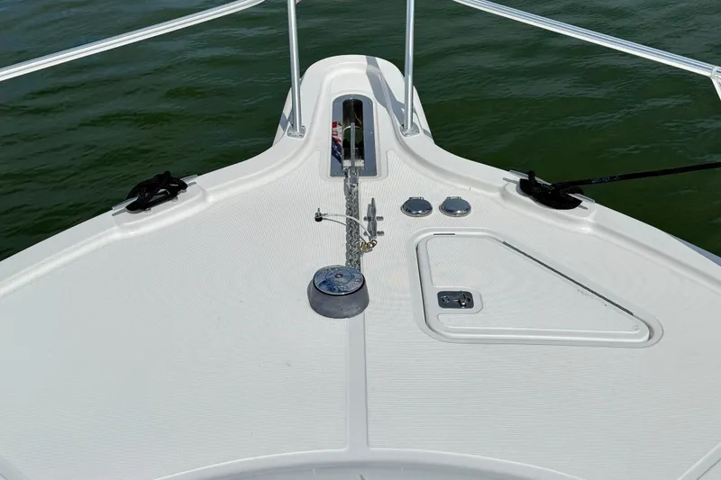 Slide: The Image of Bow of 2006 Tiara Yachts 3900 Convertible on calm water. - 42