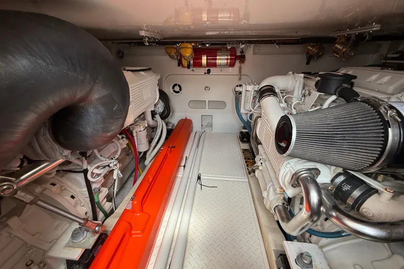 Slide: The Image of Engine room of 2006 Tiara Yachts 3900 Convertible, showcasing dual engines and equipment. - 44