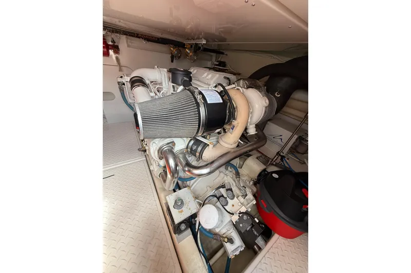 Slide: The Image of Engine room of 2006 Tiara Yachts 3900 Convertible, showcasing detailed mechanical components. - 46